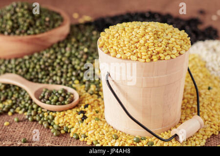 Soy beans in buckets and other on the table. Stock Photo