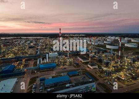 Aerial view of the petrochemical oil refinery plant shines at night Stock Photo