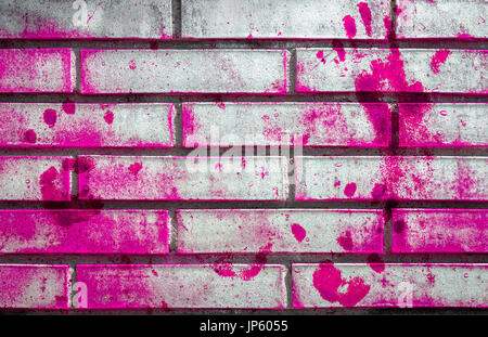 Pink handprints and blotches of paint on grunge wall. Background for creative content, design, t-shirts and more. Fully editable. Stock Photo