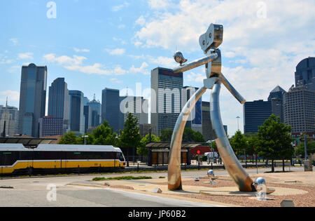 Traveling Man Walking Tall by Brad Oldham is across from the Deep Ellum DART station and one of three neighborhood sculptures east of downtown Dallas Stock Photo