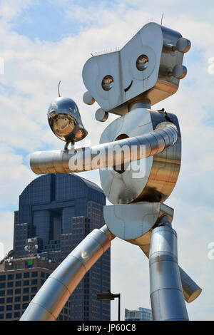 Traveling Man Walking Tall by Brad Oldham is across from the Deep Ellum DART station and one of three neighborhood sculptures east of downtown Dallas Stock Photo