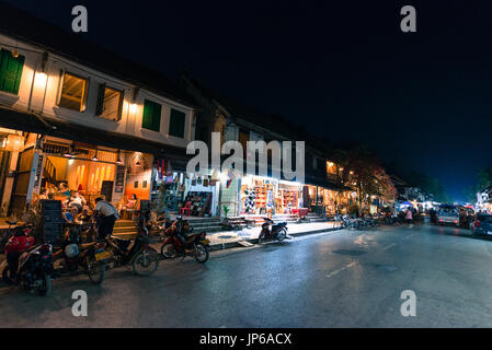 LUANG PRABANG, LAOS - MARCH 11, 2017: Night shoot of coffee shops, restaurants and stores at Sisavangvong Road, located in the olf Quarter of Luang Pr