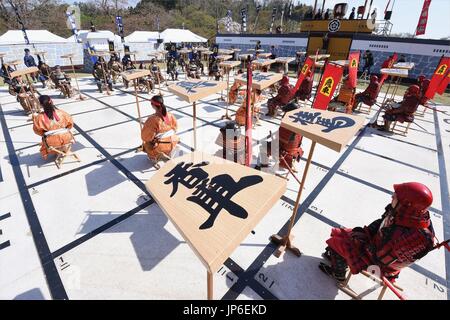 Local high school students perform Ningen Shogi, human Japanese chess on  top of Mt. Maizuru, in Tendo, Yamagata Prefecture on April 22, 2017. Tendo  is known for production of shogi koma,'' pieces