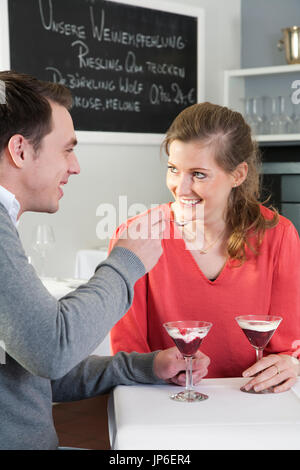 Couple eating a dessert in a restaurant