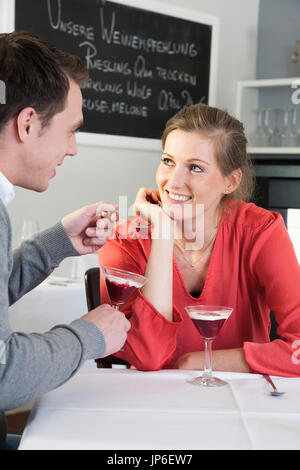 Couple eating a dessert in a restaurant
