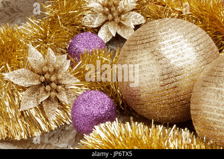 Shallow focus on a close up view of golden Christmas set decoration. Stock Photo