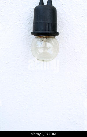 bulb on white wall background Stock Photo