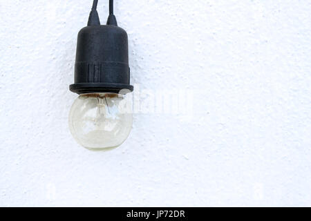 bulb on white wall background Stock Photo