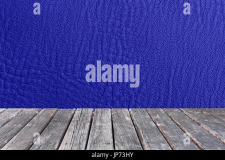 wood table on blue leather texture Stock Photo