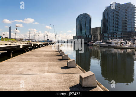 Docklands, Melbourne, Victoria, Australia. Waterfront buildings and marina, water and glass sparkling in sunshine. Stock Photo