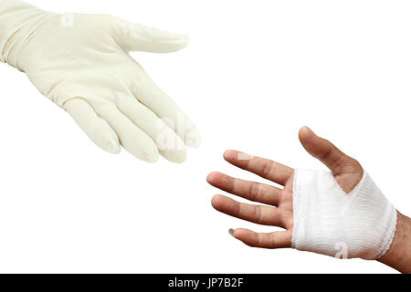 Injured painful hand with white gauze bandage and hand doctor Stock Photo