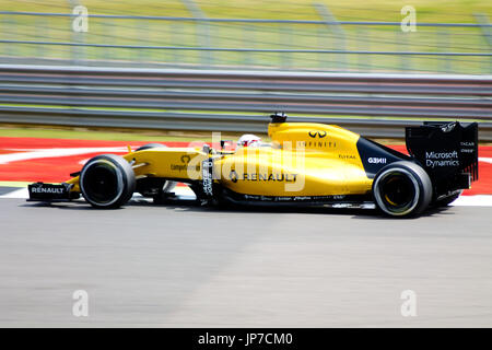 at the the first corner of the Silverstone Grand Prix circuit during the 2016 British Formula 1 Grand Prix Stock Photo