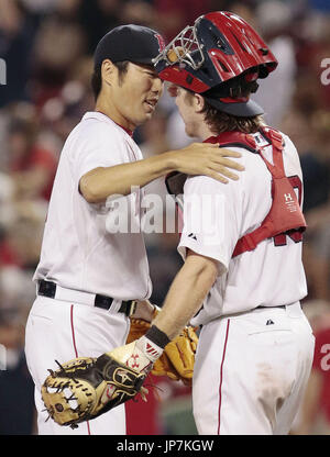 Boston Red Sox closing pitcher Koji Uehara (19) celebrates with catcher  Jarrod Saltalamacchia, right, after the Red Sox beat the Seattle Mariners  11-8 in a baseball game, Tuesday, July 9, 2013, in