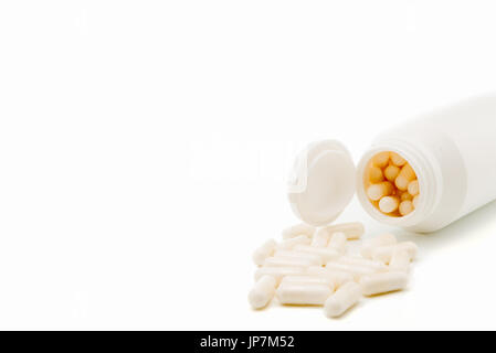 Bottle white medicine capsules isolated  on white background . horizontal Stock Photo