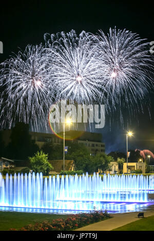 Brightly colorful fireworks above the city water fountains during the International fireworks festival in Zagreb, Croatia. Stock Photo