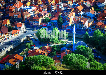 Europe, Kosovo, Prizren, Historic city on banks of Prizren Bistrica river, Aerial Old town panorama with Ottoman Mosque and houses with red roofs Stock Photo