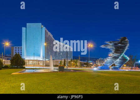 Statue of runner in front of hotel Hilton in Evangelismos in central Athens Stock Photo