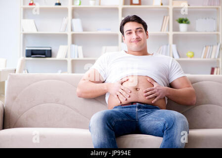 Man suffering from extra weight in diet concept Stock Photo