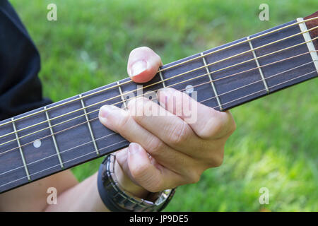 Bending the guitar string Stock Photo