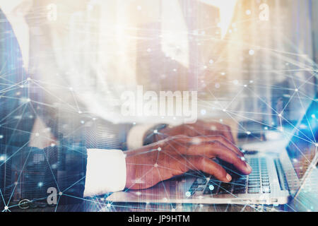 Man working on a laptop. Concept of internet sharing and interconnection Stock Photo