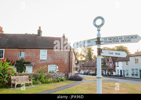 England, Hampshire, Chawton, Road Sign and Jane Austen's House Stock Photo