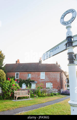 England, Hampshire, Chawton, Road Sign and Jane Austen's House Stock Photo