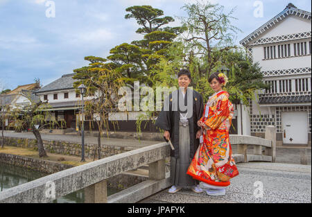 Japan, Okayama, Kurashiki City, Couple in traditional costume Stock Photo