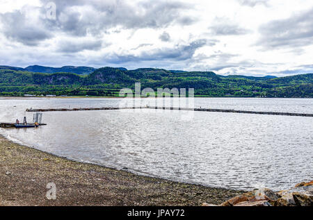 L'Anse-Saint-Jean, Canada - June 2, 2017: Riverfront houses cityscape ...