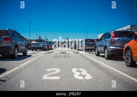 Cars waiting in ferry lineup. BC Ferries Tsawwassen Ferry Terminal, British Columbia, Canada. Stock Photo