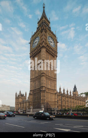 The typical black cabs on the way beside Big Ben and Westminster Palace London United Kingdom Stock Photo