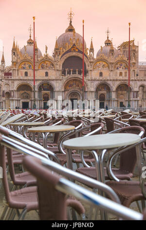 Europe, Italy, Veneto, Venice. Rows of chairs and tables at the outdoor cafe in St. Mark square Stock Photo