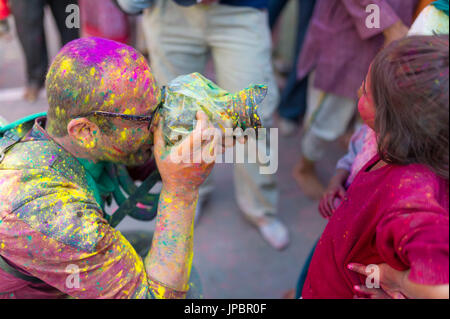 Photographer during the celebrations of the Holi festival in Mathura, Uttar Pradesh, India Stock Photo