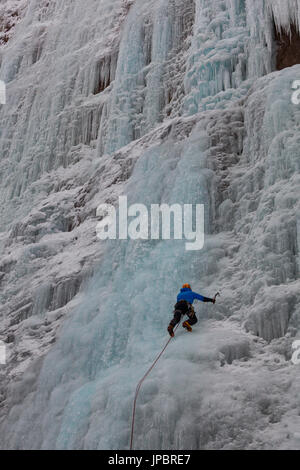 Ice climbing in Serrai of Sottoguda, Veneto, Belluno, Italy. The Cathedral, Dolomites Stock Photo