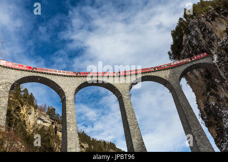 Bernina Express red train  along Landwasser Viaduct. Filisur, Graubunden, Switzerland, Europe. Stock Photo