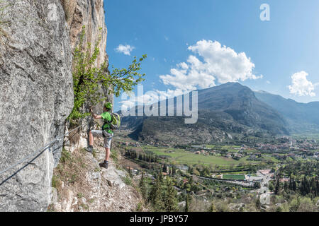 Arco, Trento province, Trentino, Italy. Climber on the via ferrata Colodri Stock Photo