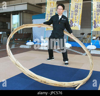 Yoichi Ninagawa, president of Nitto Jozo Inc., a white soy sauce maker, stands with a Taga Hoop in Hekinan, Aichi Prefecture in July 2016. Japanese soy sauce and miso fermented soybean paste makers have been holding competitions to hula 'taga,' or the bamboo hoop used to fasten the wooden barrel that holds the fermented products, in a bid to maintain the condiments' traditional production method. (Kyodo) ==Kyodo