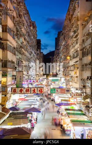 Night market in busy Fa Yuen Street in Mong Kok, Hong Kong, China. The area is popular with tourists and locals for its cheap food and fashion clothin Stock Photo