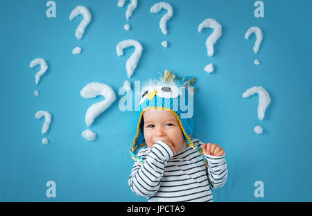 little boy with lots of question marks Stock Photo