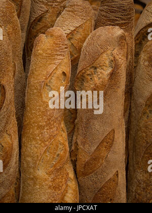 LONDON, UK - JULY 29, 2017: Fresh French Baguette loaves on an Artisan bakery stall at a Farmer's Market Stock Photo