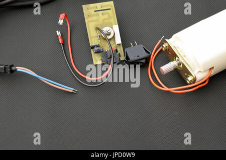 Parts for electric machine, motor, pcb, wires, potentiometer, switch. Horizontal image with copy space. Stock Photo