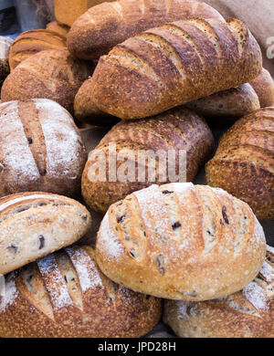 Loaves of freshly baked wholemeal and sourdough bread Stock Photo