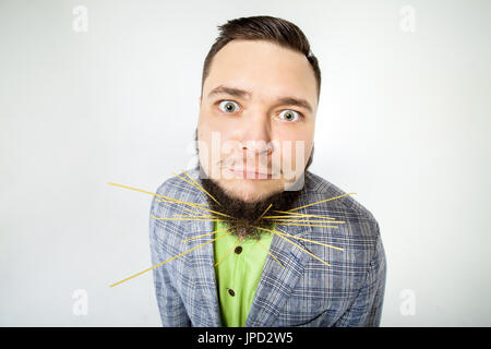 funny fat man with pasta in beard Stock Photo