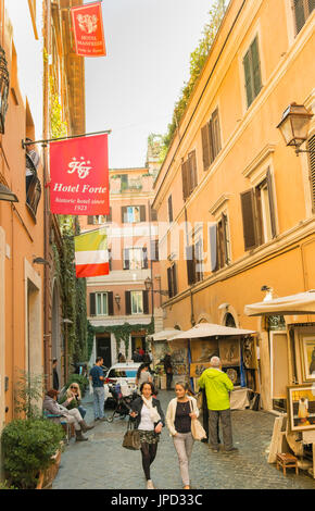 street scene in front of hotel forte, hotel manfredi, stalls of outdoor art fair via margutta, rome, lazio, italy Stock Photo