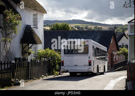 rural bus service in Dartmoor village of dunsford,Bus Driver, Bus, UK, Rural Scene, Autumn, Color Image, Cornwall - England,Emission of air pollutants Stock Photo