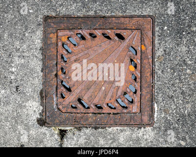 Shell symbol on drainage grids - on the Route of Santiago de Compostela, Lacommande, France. Stock Photo