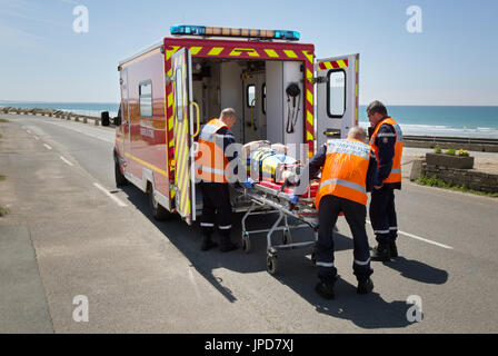 France Ambulance - a french emergency ambulance attending a road accident, Brittany, France Europe Stock Photo