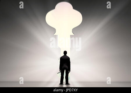 rear view of businessman standing with key hole Stock Photo