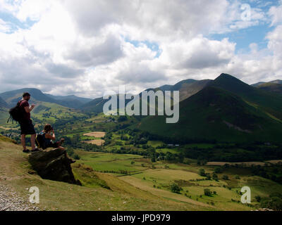 Hikers taking a break on Cat Bells Fell, The Lake District, Cumbria, UK Stock Photo