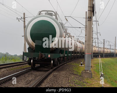 long train of fuel tanks in russia with grey sky Stock Photo