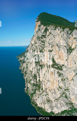 AERIAL VIEW. Monte Castello (779m asl) with its generous vertical drop over Lake Garda (65m asl). Tignale, Province of Brescia, Lombardy, Italy. Stock Photo